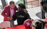 Nick Saban and Tyler Booker